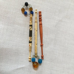Group of Sewing Items: Bone Lace Bobbins, Bakelite Needle Case, Gold Tone Walnut Sewing Kit