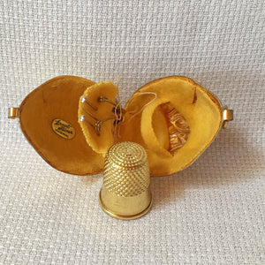 Group of Sewing Items: Bone Lace Bobbins, Bakelite Needle Case, Gold Tone Walnut Sewing Kit