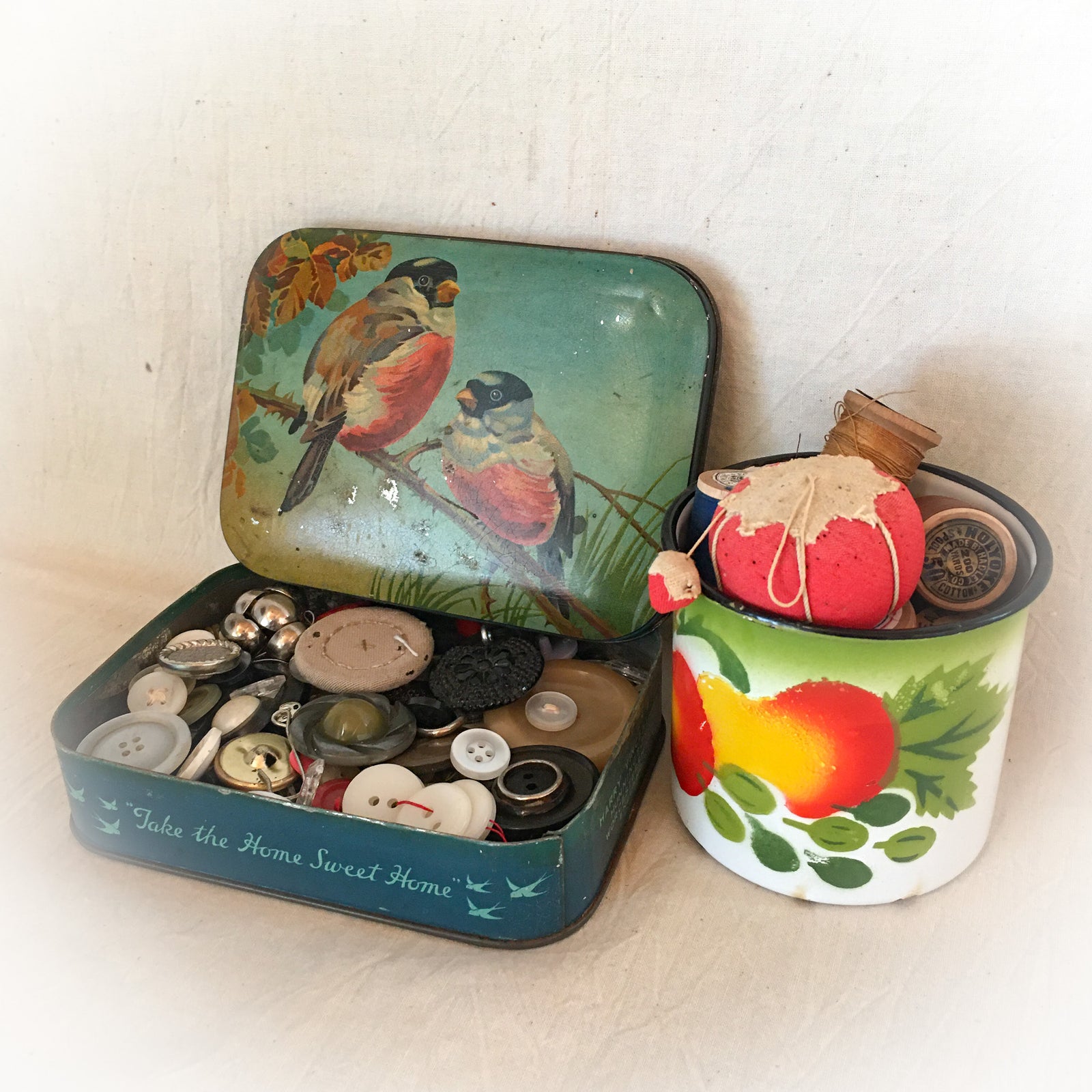 Vintage Toffee Tin with Buttons, Vintage Enamel Ware Cup with Wooden Spools and Small Tomato