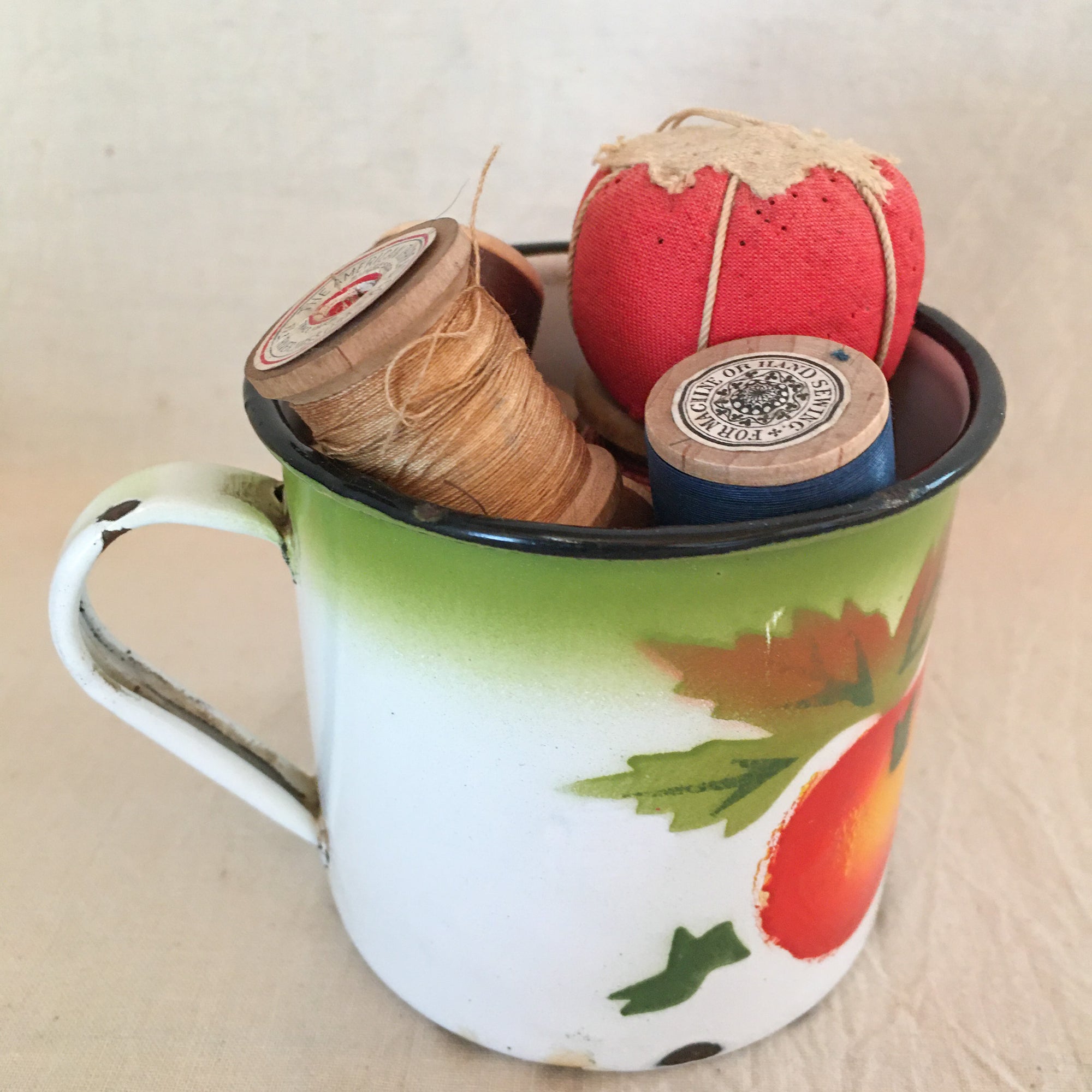 Vintage Toffee Tin with Buttons, Vintage Enamel Ware Cup with Wooden Spools and Small Tomato