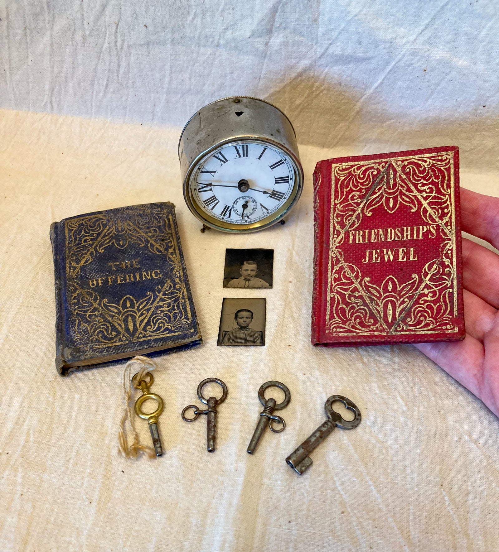 Lot of Tiny Oddities!  1894 Waterbury Clock, 2 1850’s Miniature Books, 2 1870’s Tintypes of Boy and Girl, 4 Tiny Keys
