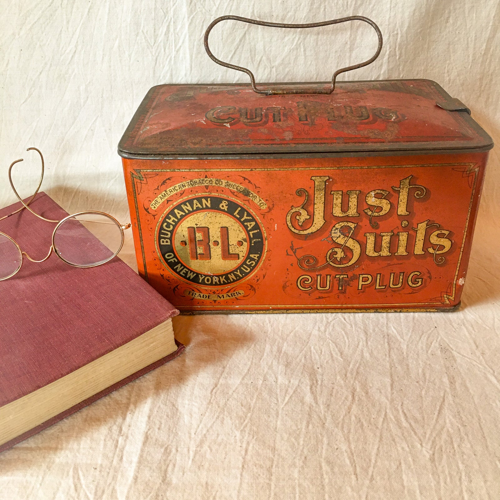 Antique “Just Suits” Tobacco Tin – Buchanan & Lyall NY – Hinged Lid, Early 1900s, orange, black and gold lettering