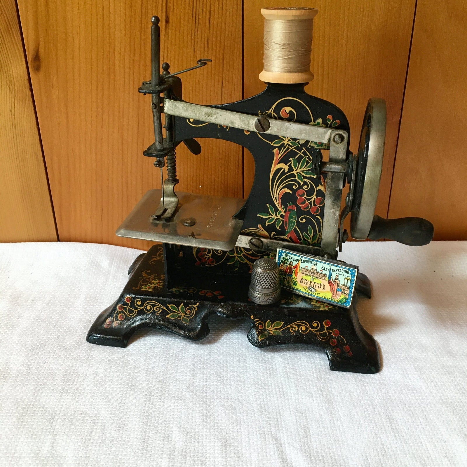 Antique German Toy Sewing Machine – Painted Cast Iron, Floral & Bird Design – c. 1920s