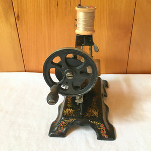 Antique German Toy Sewing Machine – Painted Cast Iron, Floral & Bird Design – c. 1920s