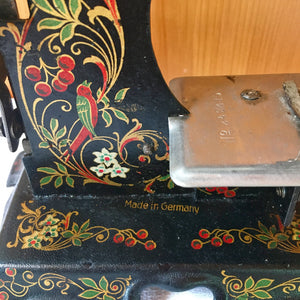 Antique German Toy Sewing Machine – Painted Cast Iron, Floral & Bird Design – c. 1920s