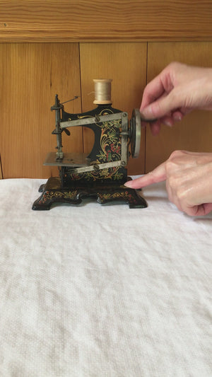 Antique German Toy Sewing Machine – Painted Cast Iron, Floral & Bird Design – c. 1920s