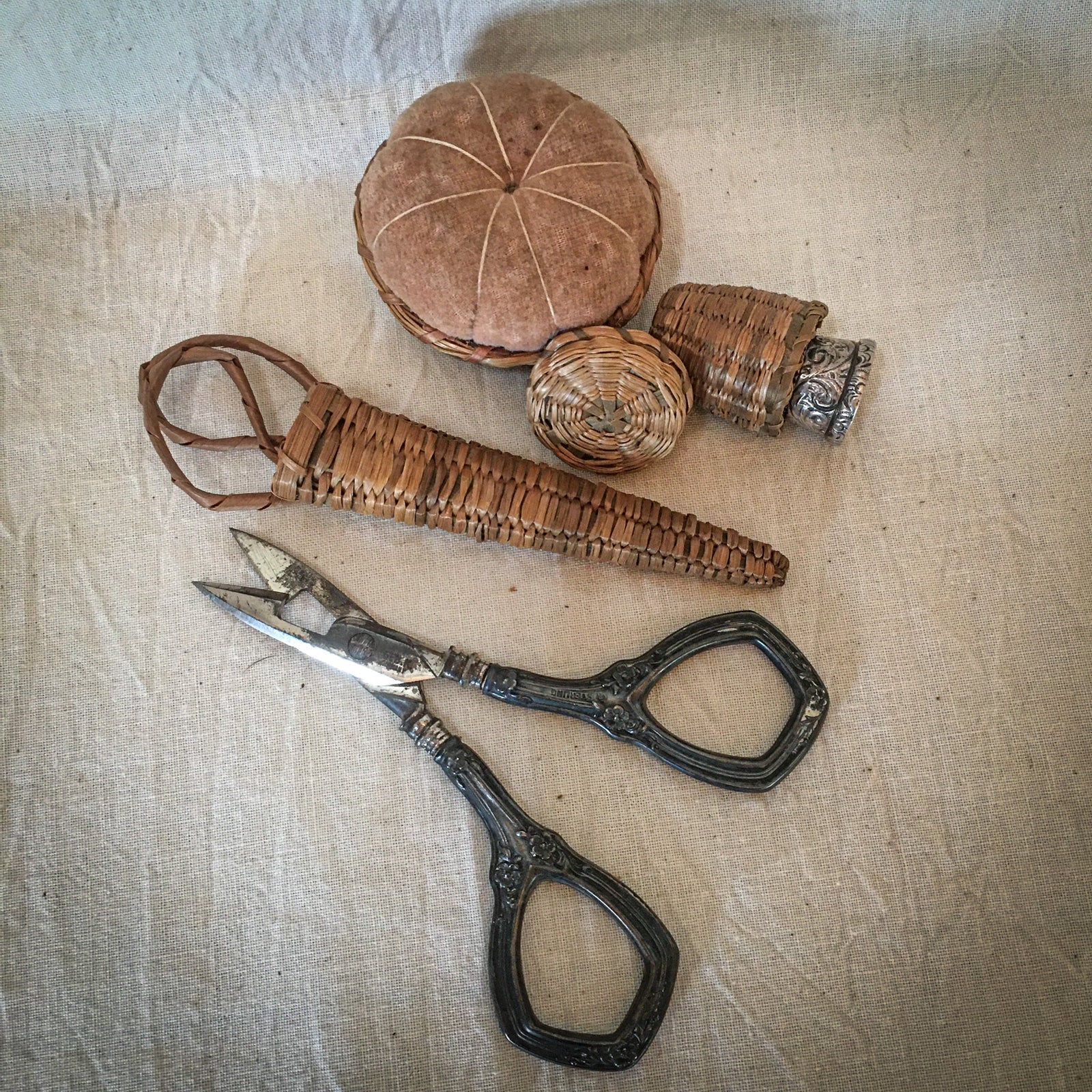 1910’s – 1930’s Woven Sweet Grass Pincushion, Thimble Basket, and Scissor Basket with Sterling Scissors and Simons Bros Sterling Thimble