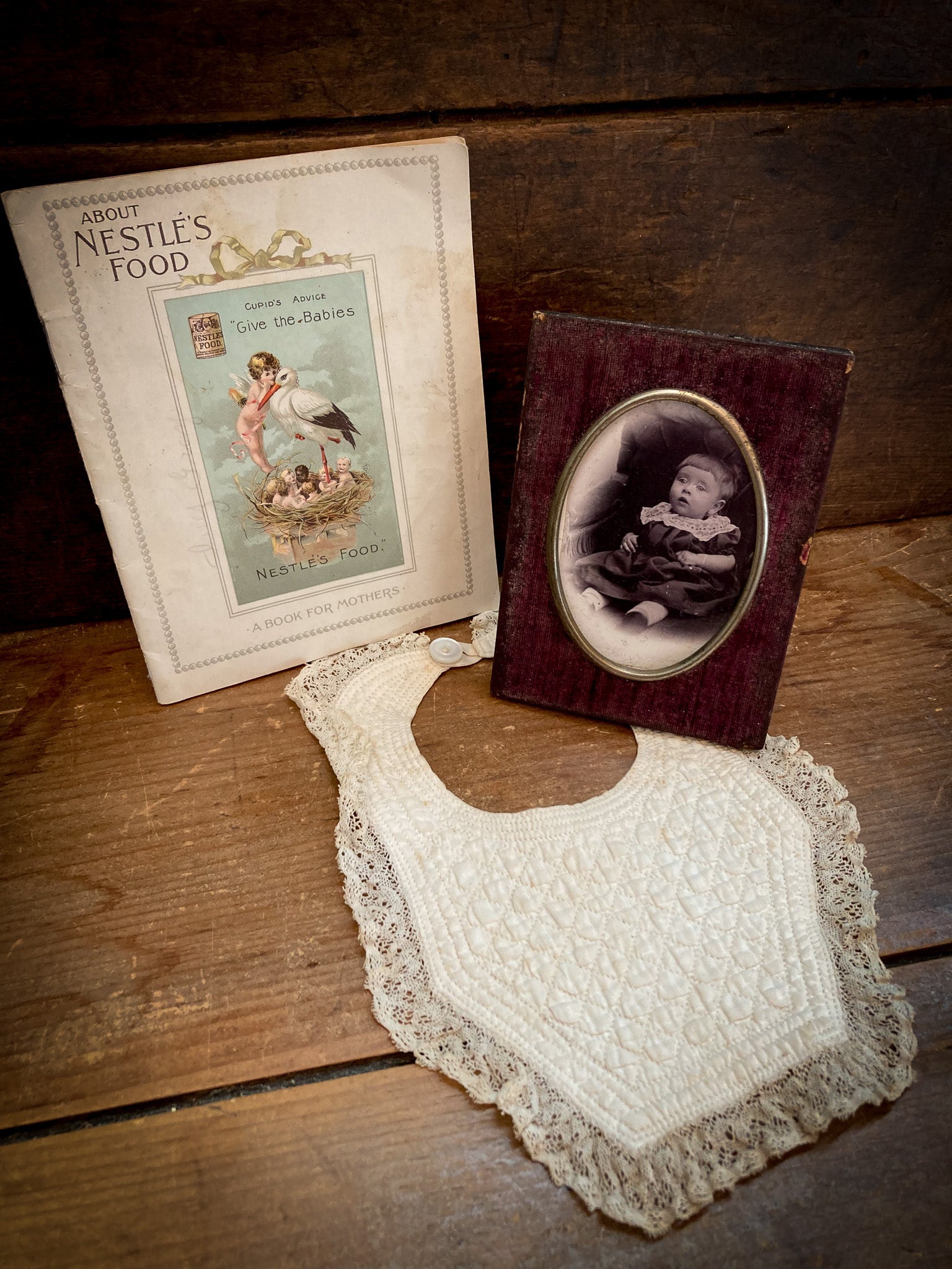 1900’s Baby Items, Photo in Velvet Frame, Nestle’s Baby Food Book, Quilted Lace Baby Bib