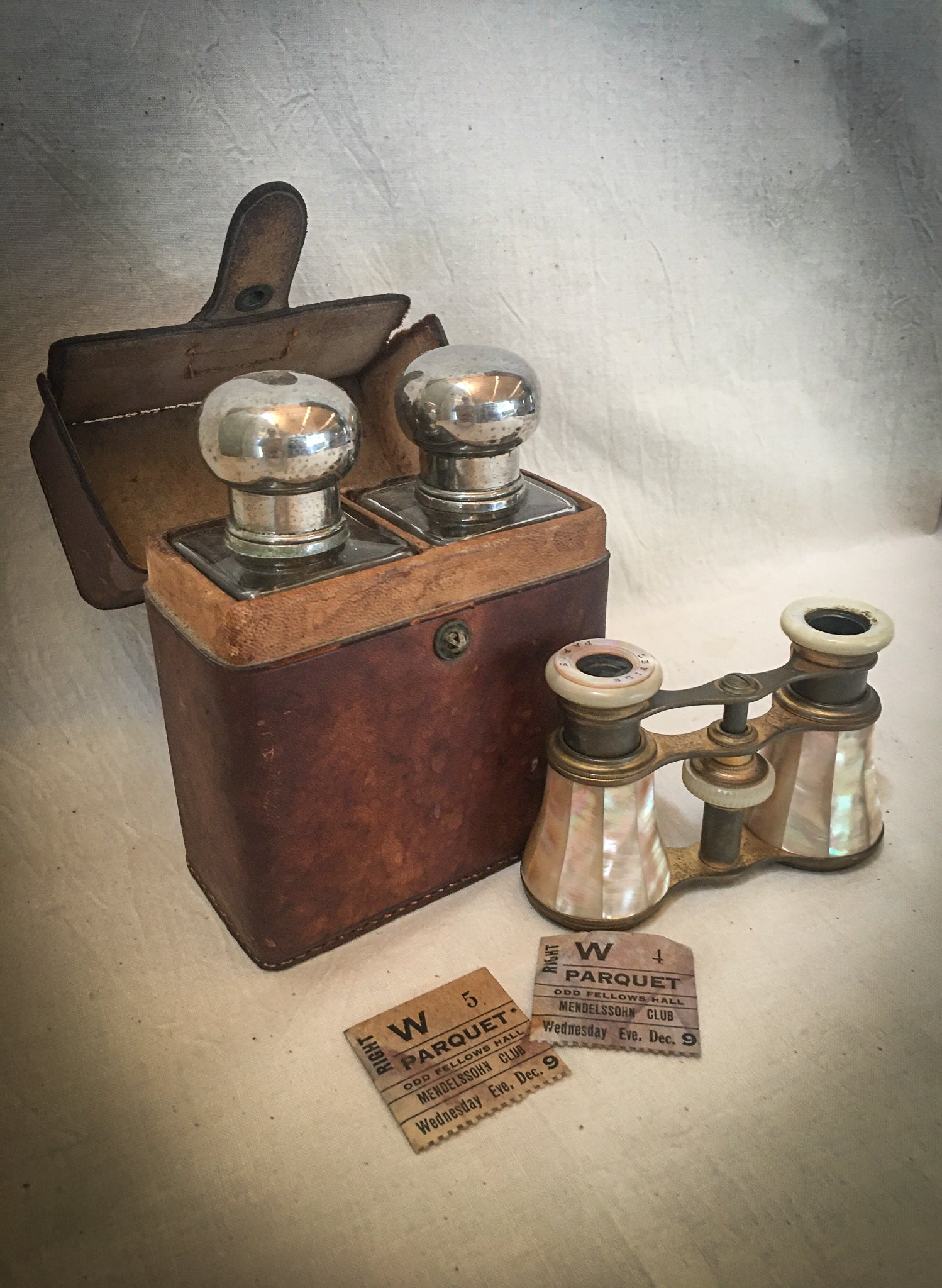 A Night Out: 1920’s Medicine Bottles with Silver Tops, in a Leather Travel Case AND 1910’s LeFils Paris Mother of Pearl Opera Glasses